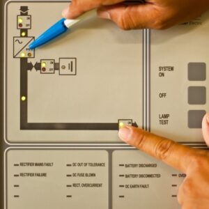 close-up of a technician working on a control panel for a building management system