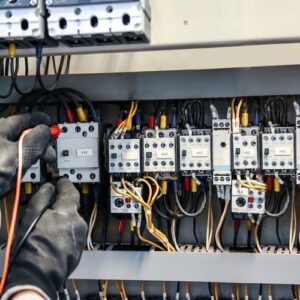 technician working on wiring in a building management system